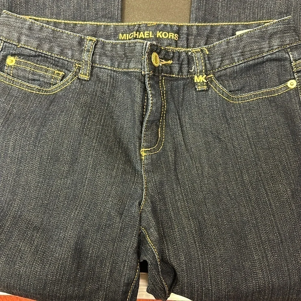 94.  Michael Kors dark blue skinny jeans with embellished pockets size 4